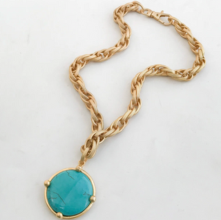 Gold chain necklace with a turquoise pendant