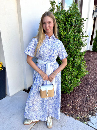 Blue and white printed maxi dress with a button up bodice, short sleeves and a contrasting tie waist. 