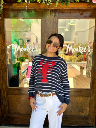 Navy and white striped sweater with red lobster on front