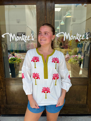 Long balloon sleeve blouse with palm tree embroidery. 