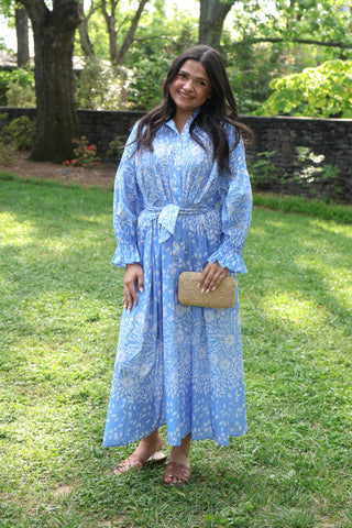 Blue and white floral maxi dress with long sleeves and a tie wasit.