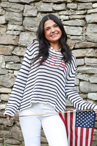 White and navy striped sweater with USA embroidered. 