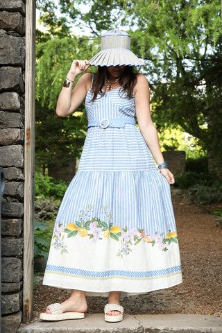 blue and white striped maxi dress with floral designs at the bottom.