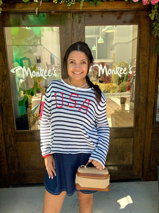 Navy and white striped sweater with USA embroidered on it