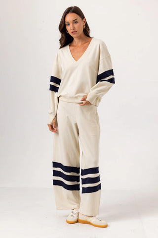 Ivory wide leg sweatpants with navy stripe